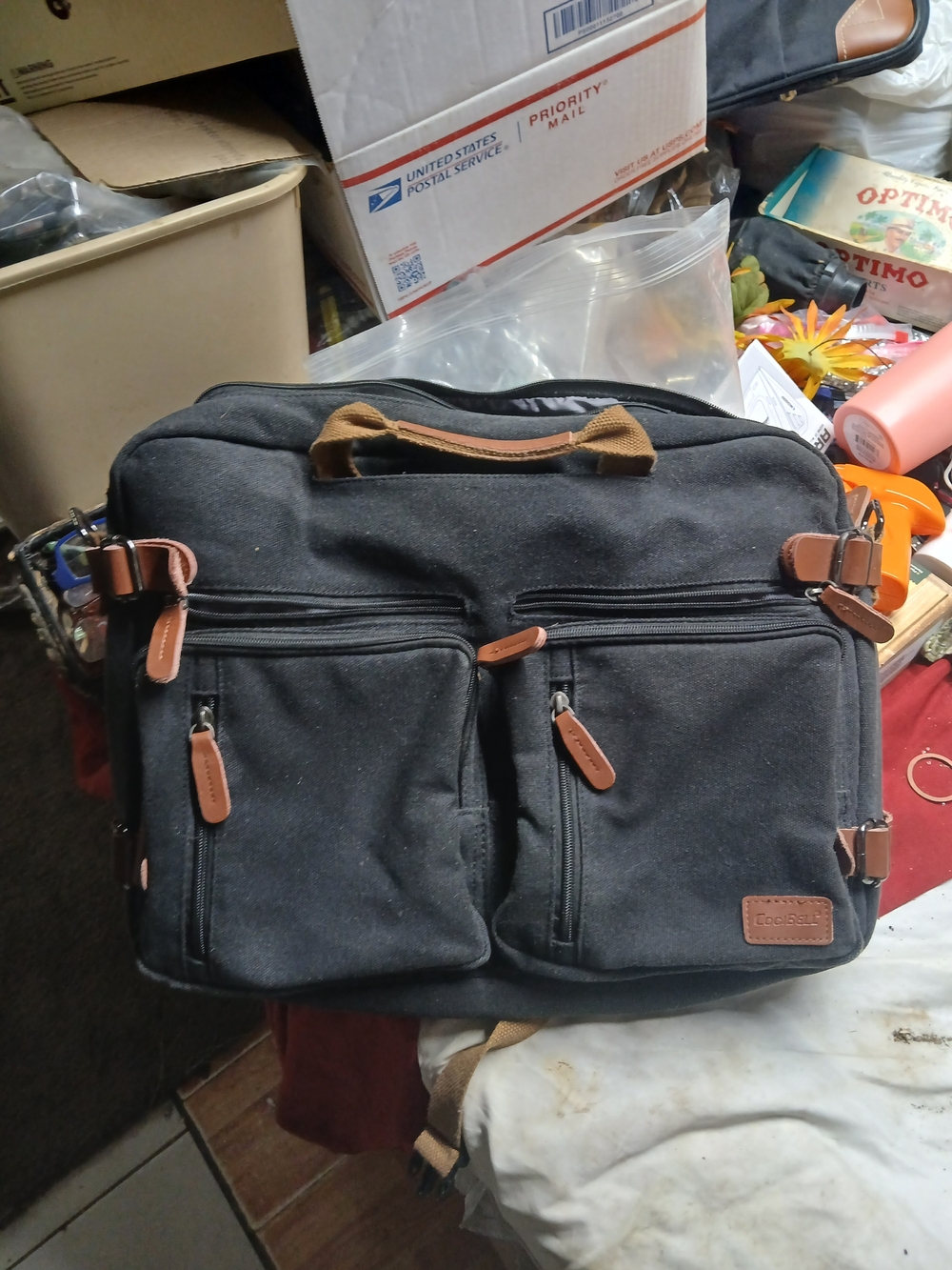 CoolBell CB-5005 convertible laptop messenger bag can be used as a Backpack